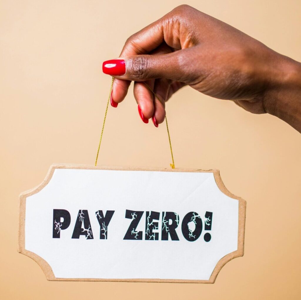 A hand holds a 'Pay Zero' sign, symbolizing cost savings or free content.